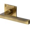Heritage Brass Trident Low Profile Antique Brass Door Handles On Square Rose (sold in pairs)
