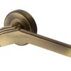 Heritage Brass Tiffany Art Deco Style Door Handles On Round Rose, Antique Brass (sold in pairs)