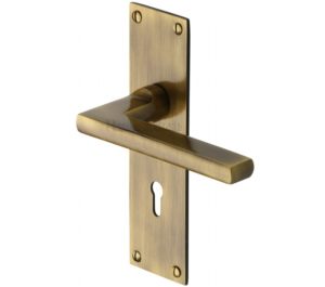 Heritage Brass Trident Low Profile Door Handles On Backplates, Antique Brass - (sold in pairs)