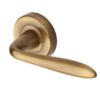 Heritage Brass Sutton Antique Brass Door Handles On Round Rose (sold in pairs)