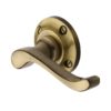 Heritage Brass Bedford Antique Brass Door Handles On Round Rose (sold in pairs)