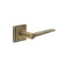 Knightsbridge Door Handle on Square Stepped Rose Antique Brass