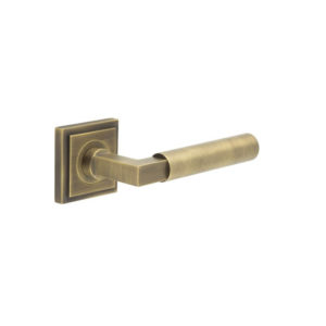 Westminster Door Handle on Square Stepped Rose Antique Brass